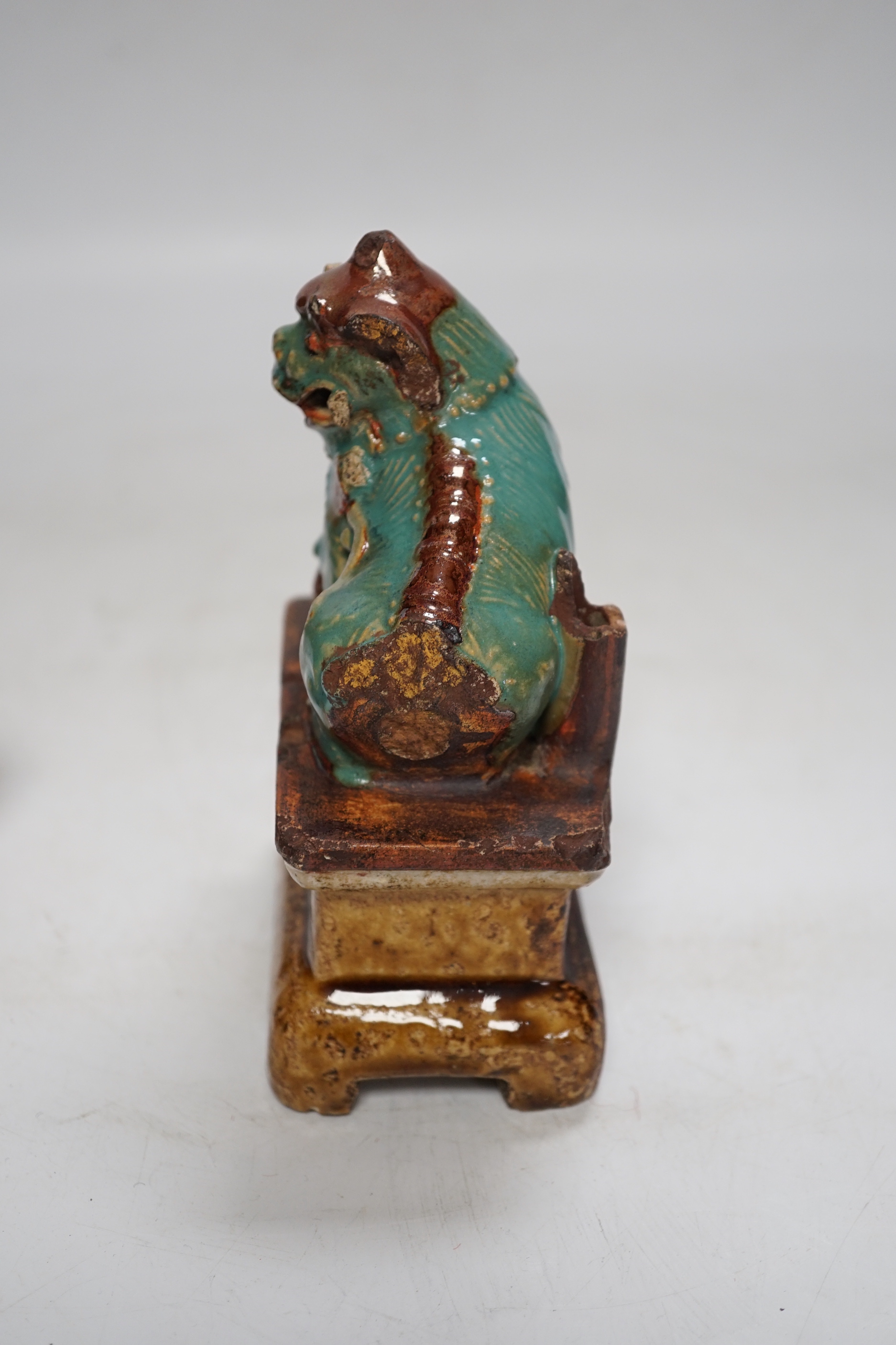 A 19th century Chinese Shiwan figure of a lion-dog, a celadon glazed shallow bowl and a cloisonné enamel censer, tallest 14cm (3)